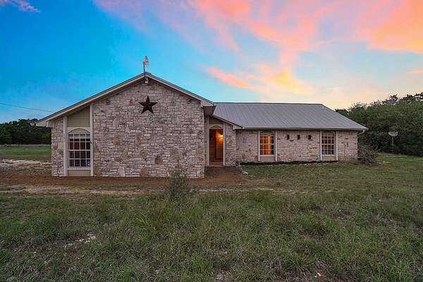 12.8 Acres of Land with Home for Sale in Dripping Springs, Texas