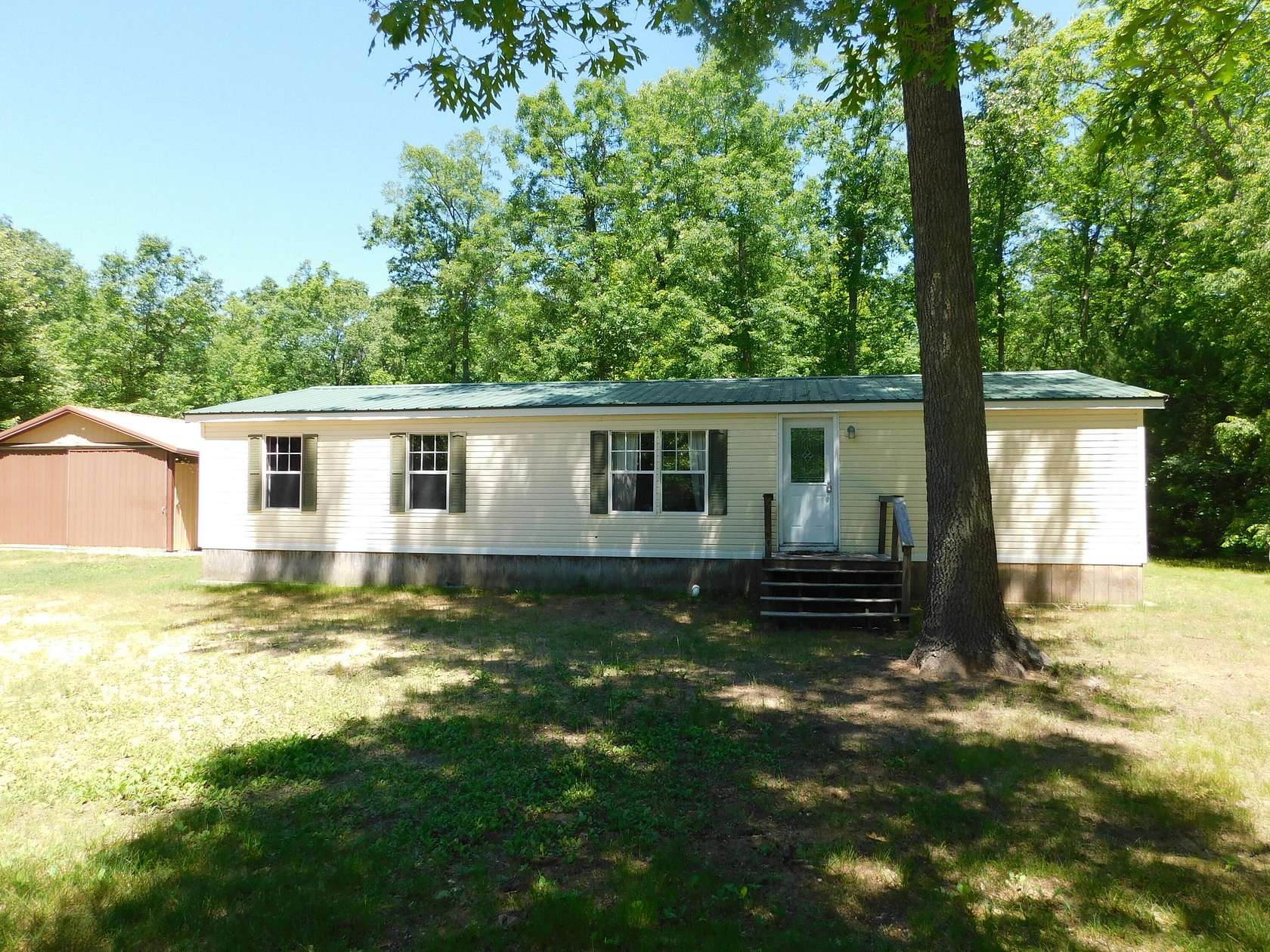 2.5 Acres of Land with Home for Sale in Wellston, Michigan