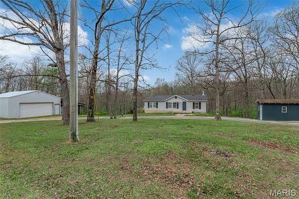 5.49 Acres of Land with Home for Sale in Pinckney Township, Missouri