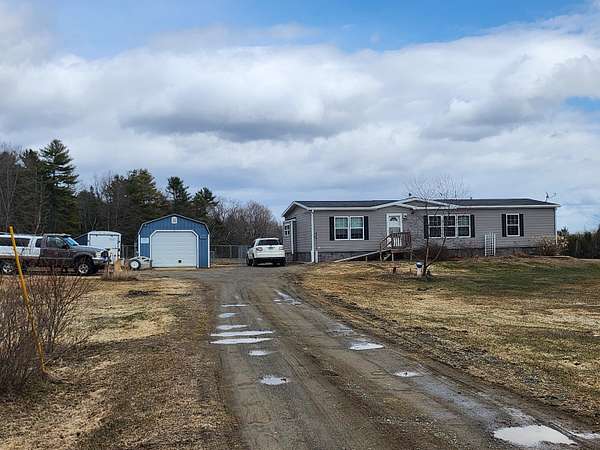5.6 Acres of Land with Home for Sale in Corinna, Maine