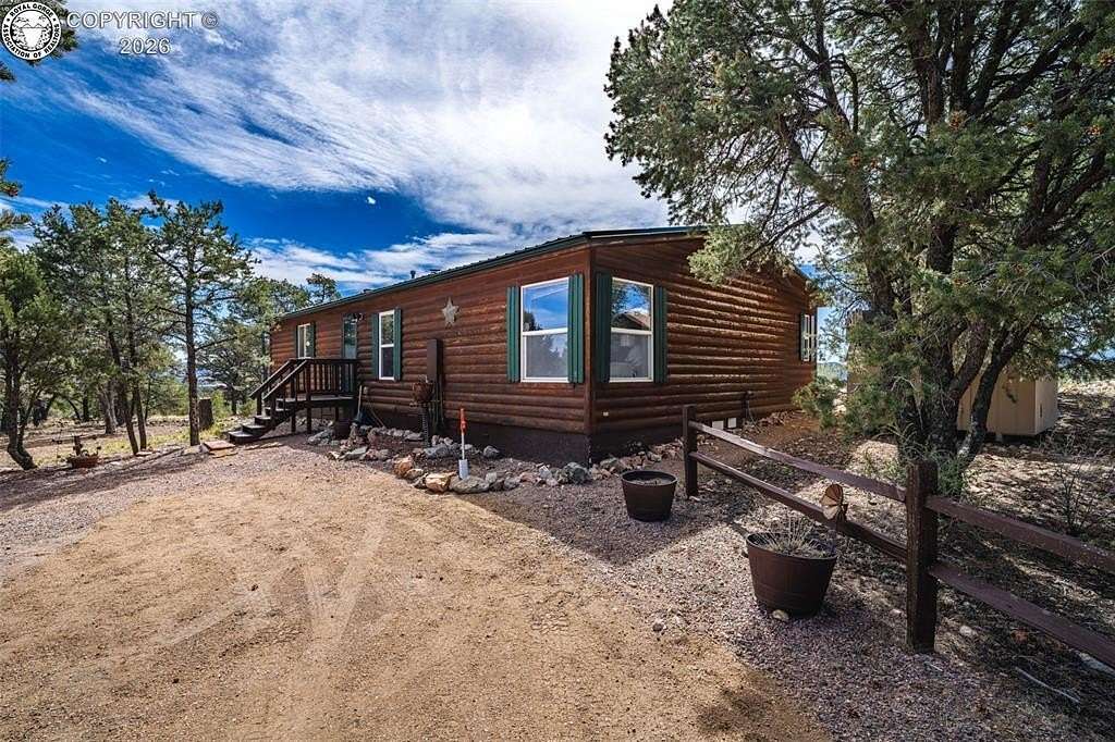 72.6 Acres of Recreational Land with Home for Sale in Texas Creek, Colorado