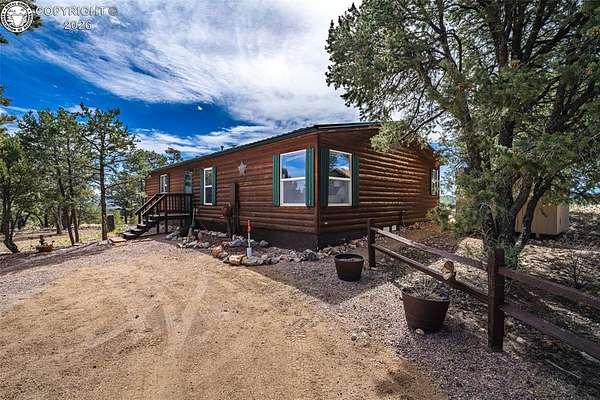 72.6 Acres of Recreational Land with Home for Sale in Texas Creek, Colorado