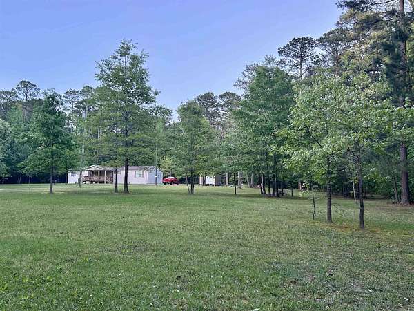 6.6 Acres of Land with Home for Sale in Traskwood, Arkansas