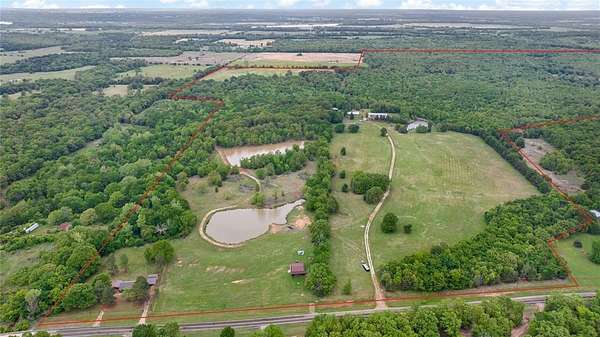 399 Acres of Land with Home for Sale in Arthur City, Texas