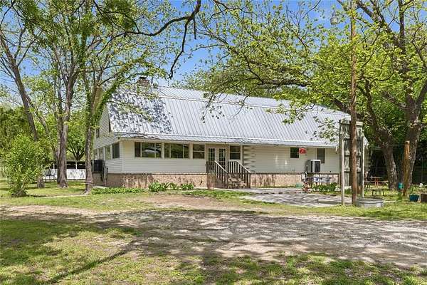 8.89 Acres of Land with Home for Sale in Mullin, Texas