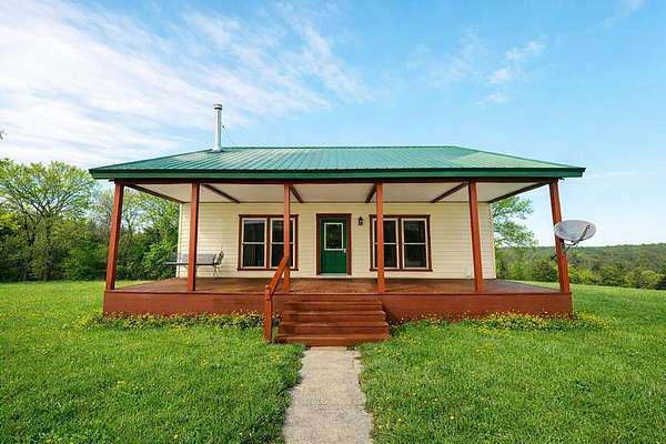 63 Acres of Agricultural Land with Home for Sale in Highlandville, Missouri