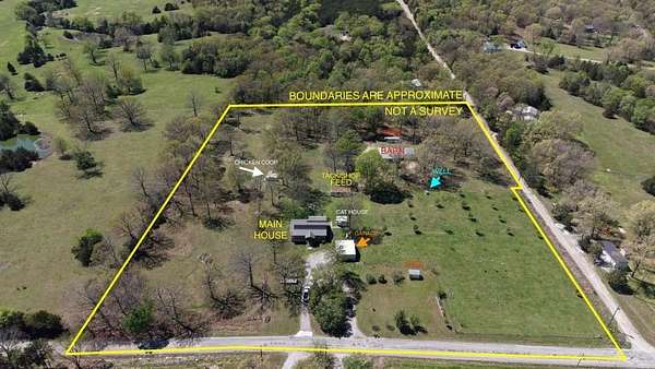8.75 Acres of Land with Home for Sale in Flippin, Arkansas