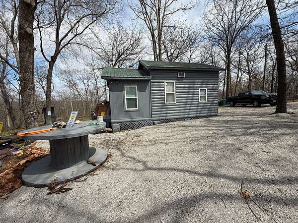 54.9 Acres of Recreational Land with Home for Sale in Deepwater, Missouri