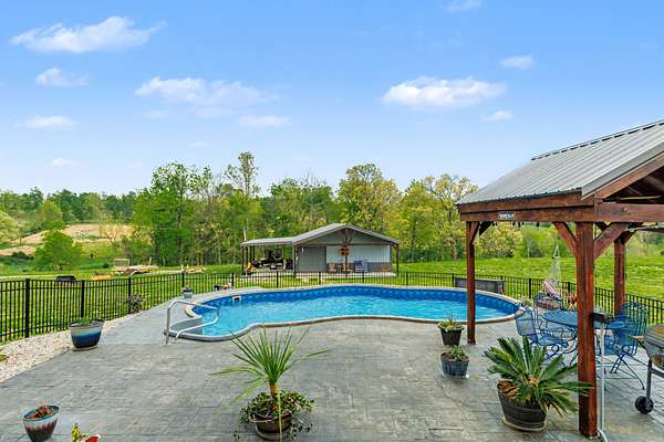 11.1 Acres of Land with Home for Sale in Westmoreland, Tennessee