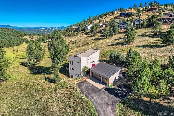 5 Acres of Land with Home for Sale in Indian Hills, Colorado