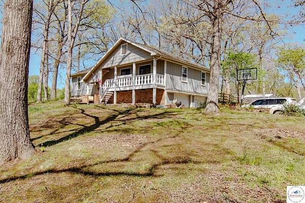 10 Acres of Recreational Land with Home for Sale in Clinton, Missouri