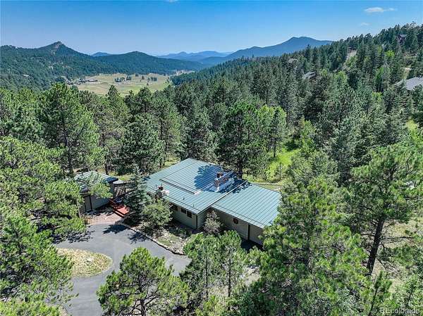 5.4 Acres of Land with Home for Sale in Evergreen, Colorado