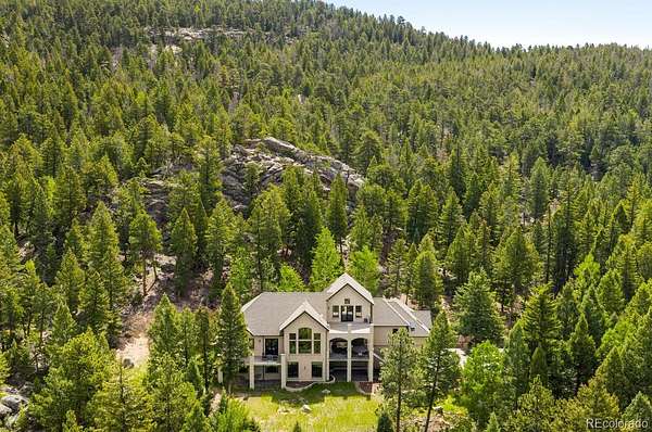 7.14 Acres of Land with Home for Sale in Evergreen, Colorado