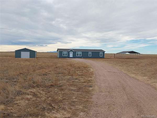38.6 Acres of Agricultural Land with Home for Sale in Yoder, Colorado