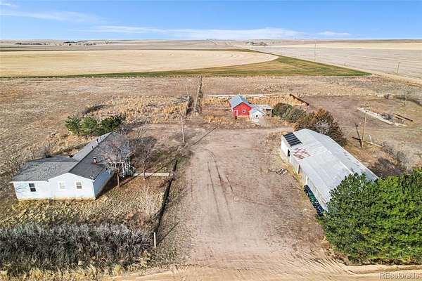 35 Acres of Agricultural Land with Home for Sale in Wiggins, Colorado