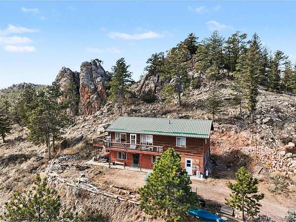 4.23 Acres of Land with Home for Sale in Red Feather Lakes, Colorado
