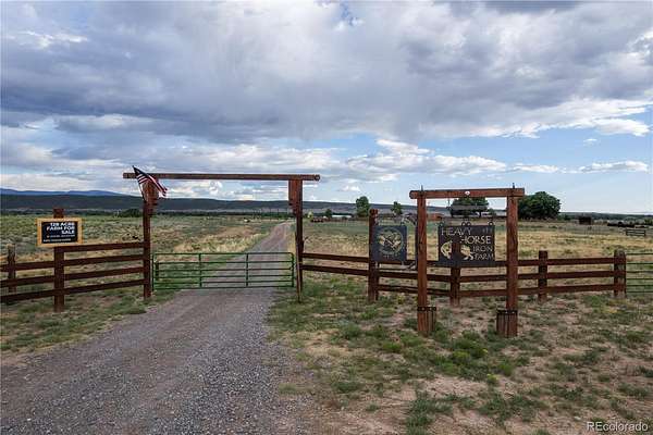 128 Acres of Agricultural Land with Home for Sale in San Luis, Colorado