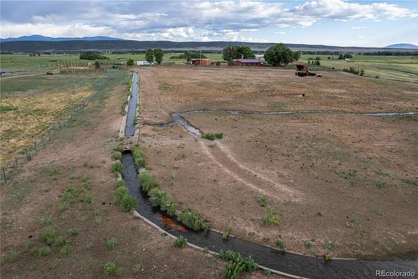128 Acres of Agricultural Land with Home for Sale in San Luis, Colorado