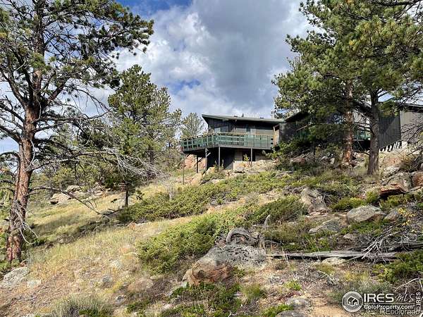 1.64 Acres of Land with Home for Sale in Red Feather Lakes, Colorado