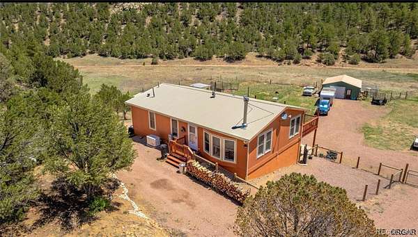 12.1 Acres of Recreational Land with Home for Sale in Cotopaxi, Colorado