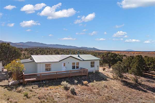 5 Acres of Land with Home for Sale in Fort Garland, Colorado