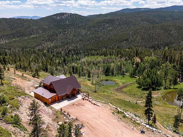 23.3 Acres of Land with Home for Sale in Red Feather Lakes, Colorado