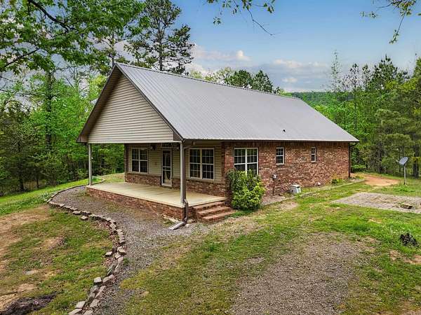 9.6 Acres of Land with Home for Sale in Clarksville, Arkansas