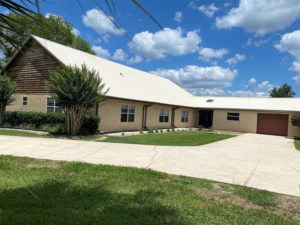 9.68 Acres of Land with Home for Sale in Interlachen, Florida
