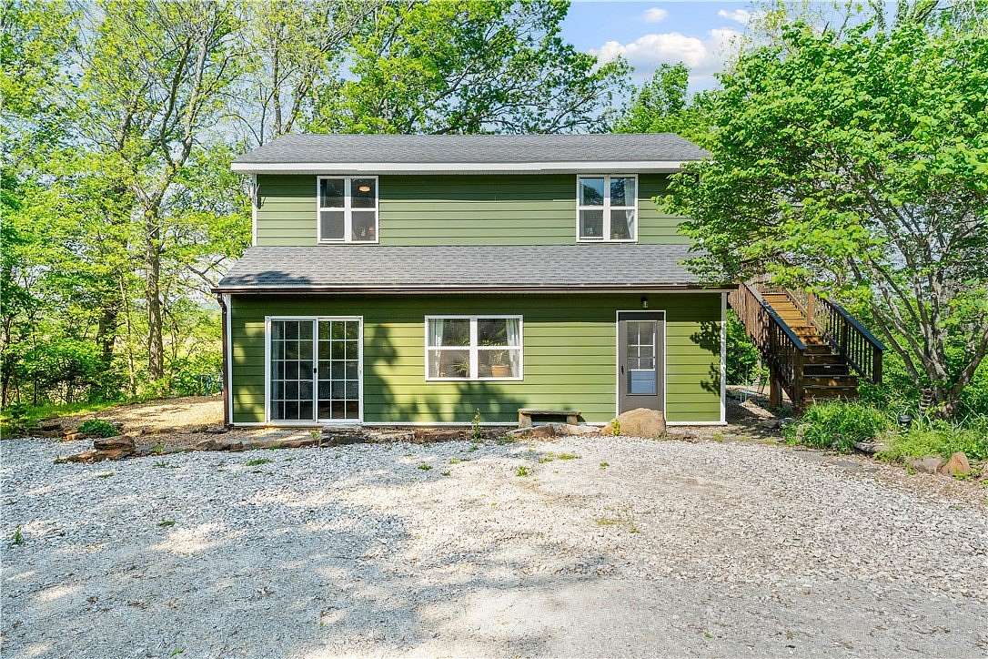 8 Acres of Land with Home for Sale in Elkins, Arkansas