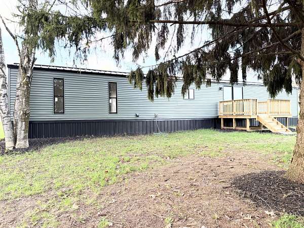 2.57 Acres of Land with Home for Sale in Six Lakes, Michigan