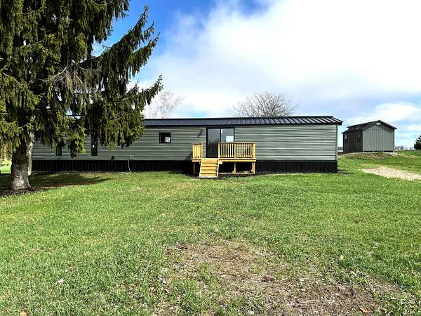 2.57 Acres of Land with Home for Sale in Six Lakes, Michigan