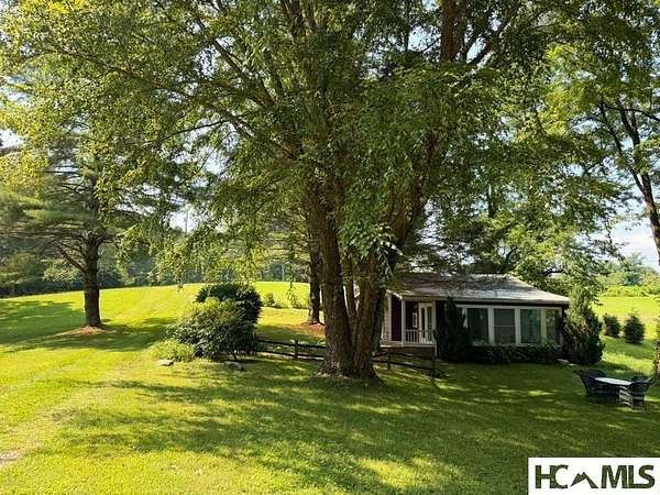 8.72 Acres of Land with Home for Sale in Scaly Mountain, North Carolina