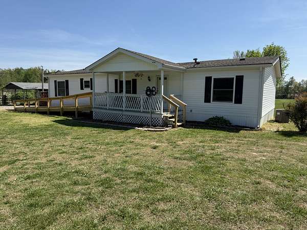 7.39 Acres of Land with Home for Auction in Bradyville, Tennessee