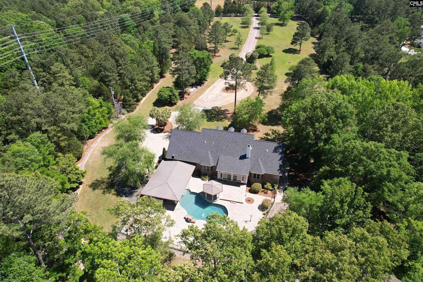 9.3 Acres of Land with Home for Sale in Chapin, South Carolina