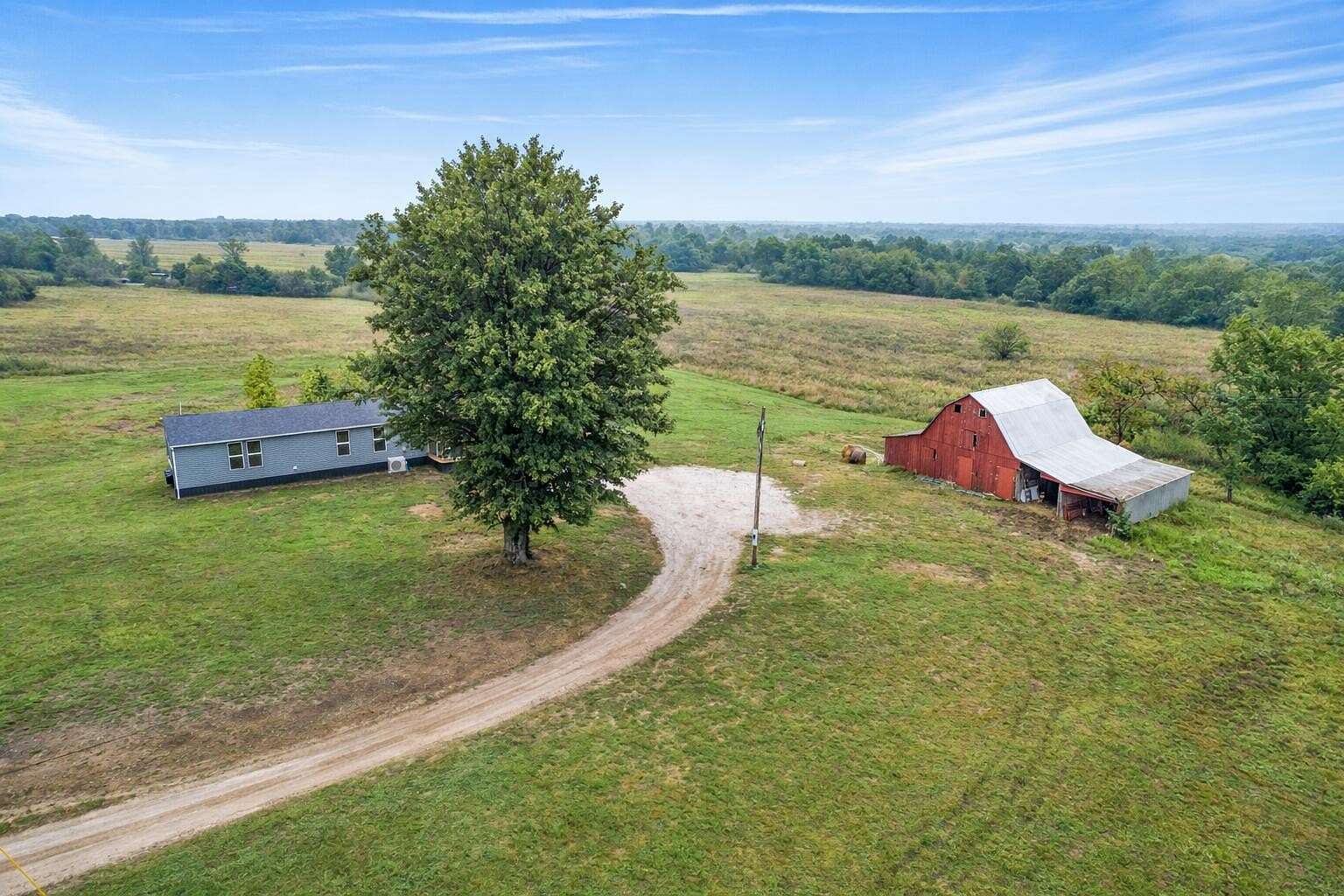 69.3 Acres of Land with Home for Sale in Huntsville, Missouri