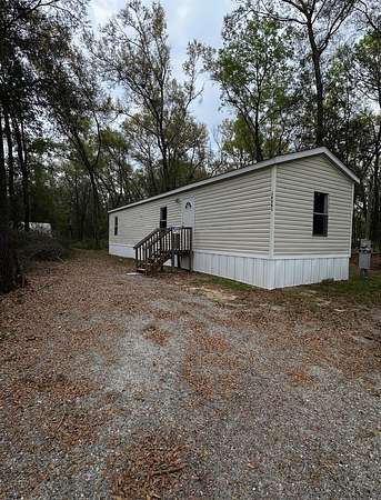 2.56 Acres of Land with Home for Sale in Archer, Florida