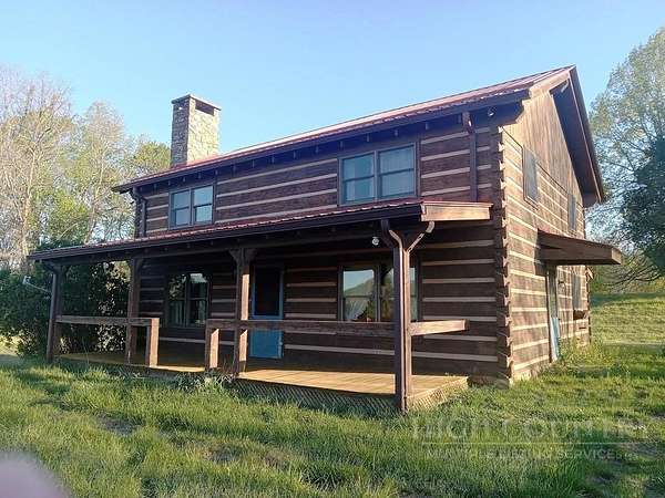 7.23 Acres of Land with Home for Sale in Lansing, North Carolina