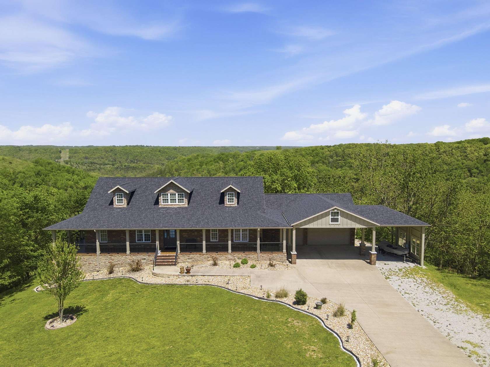 6.6 Acres of Land with Home for Sale in Reeds Spring, Missouri