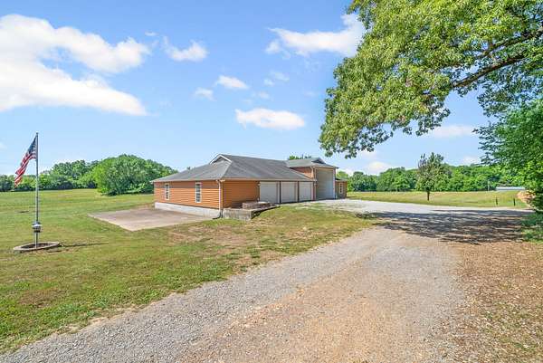 5.12 Acres of Land with Home for Sale in Cedar Hill, Tennessee