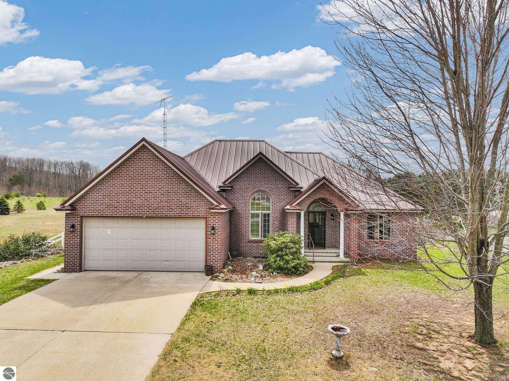 21 Acres of Recreational Land with Home for Sale in Manton, Michigan