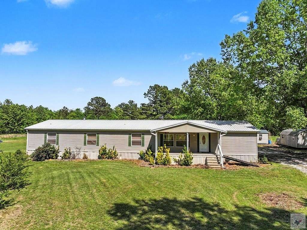 5 Acres of Land with Home for Sale in De Kalb, Texas