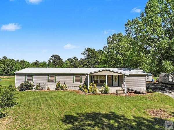 5 Acres of Land with Home for Sale in De Kalb, Texas