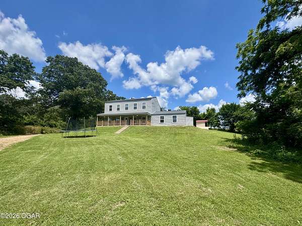 9.84 Acres of Land with Home for Sale in Neosho, Missouri