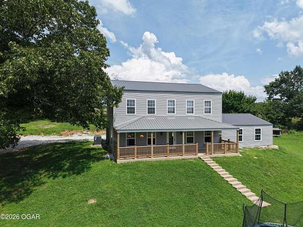 9.84 Acres of Land with Home for Sale in Neosho, Missouri