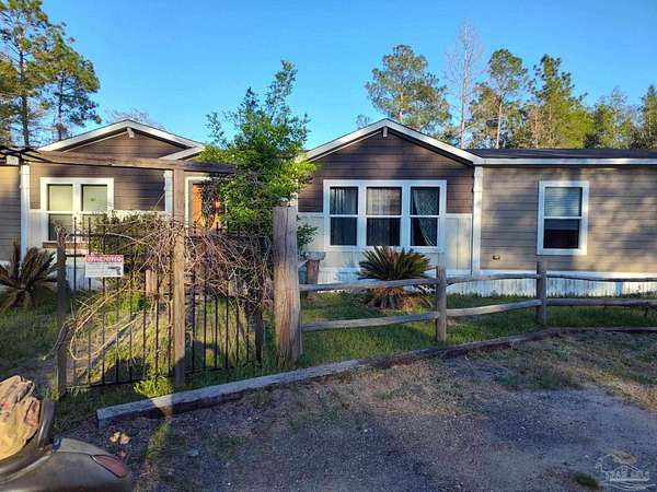 2.66 Acres of Land with Home for Sale in Milton, Florida