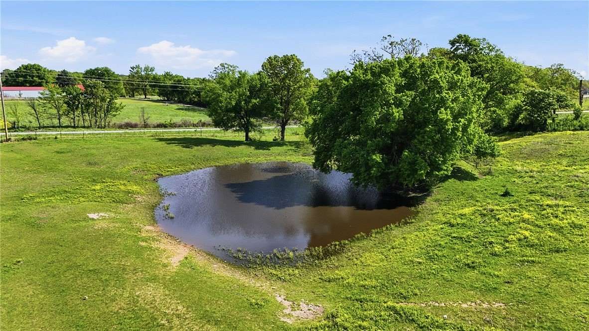 20 Acres of Agricultural Land with Home for Sale in Gravette, Arkansas