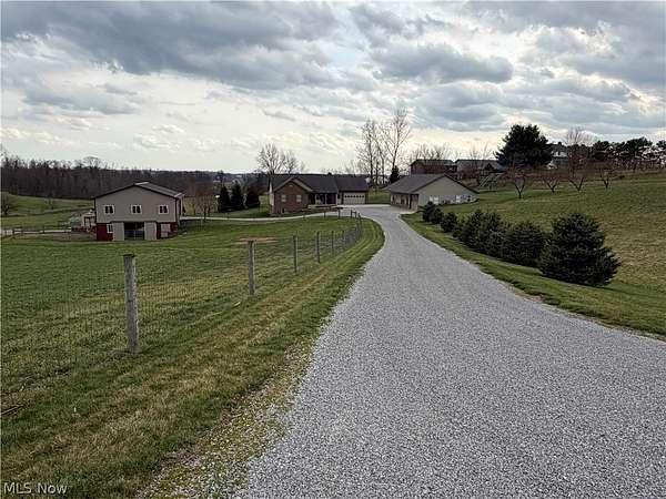 6.1 Acres of Land with Home for Auction in Millersburg, Ohio