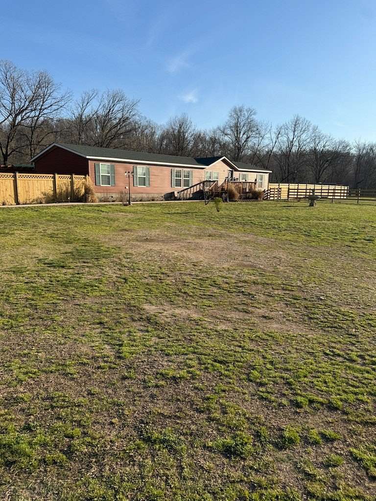 18.1 Acres of Land with Home for Sale in Gravette, Arkansas