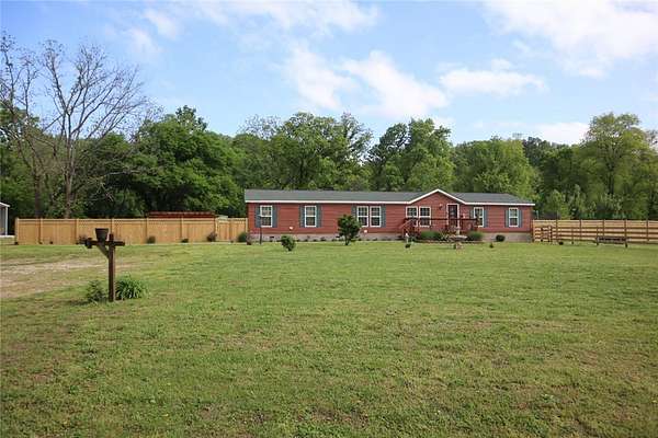 18.1 Acres of Land with Home for Sale in Gravette, Arkansas