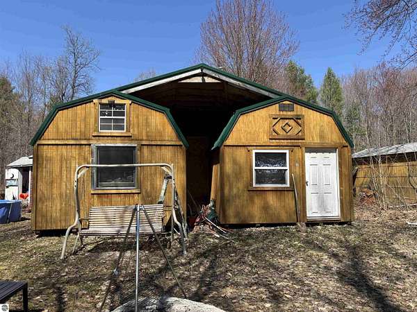 10 Acres of Recreational Land with Home for Sale in Elmira, Michigan